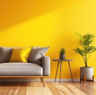 Salon moderne canapé gris et mur jaune, mesurage Loi Boutin
